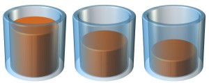 Three transparent cylinders showing three different fill levels